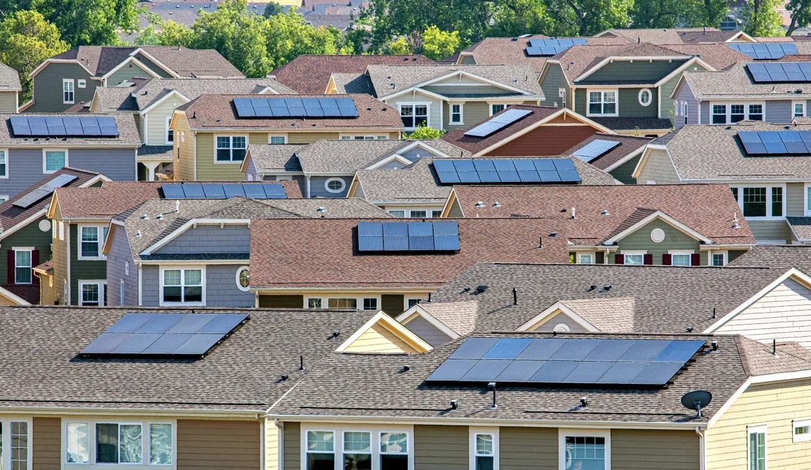 Solar panels on residential rooftops in an American neighborhood
